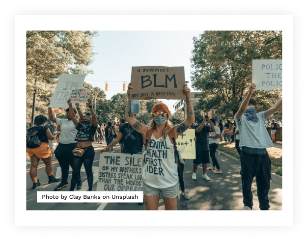 Girl holding blm sign in march