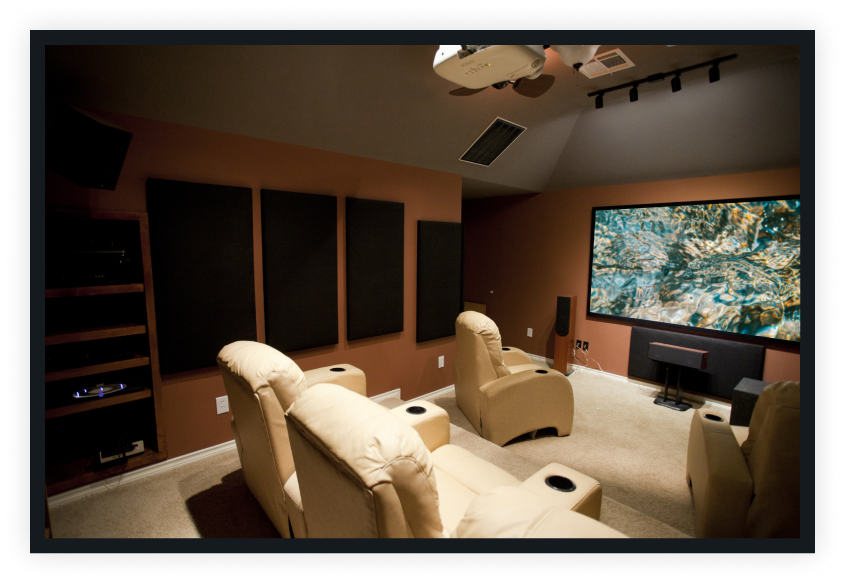 home theater with tan seats and sound panels