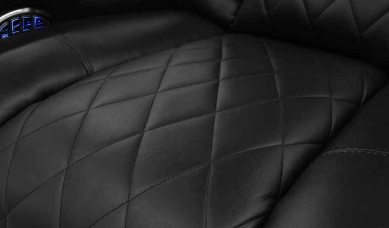 black recliner with two cup holders