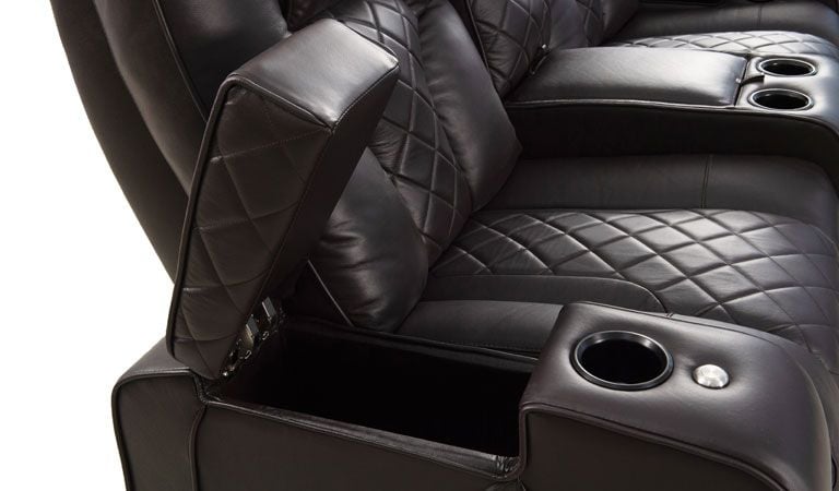 brown theater seating with cup holder